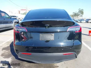 2023 Tesla Model Y Long Range with VIN 7SAYGDEE9PF898249, listed as a IAAI auction lot 41680998 with 7,900 mi miles. Bid and sale history available at carsss.com. Image 15.