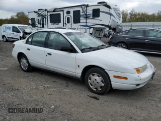 2002 Saturn SL z VIN 1G8ZH52842Z303274, wystawiony jako Copart lot #55164235 z przebiegiem 123 177 mil mil oraz Tytuł czysty. Historia ofert i sprzedaży dostępna na DreamBid. Obrazek 4.