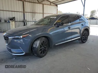 2021 Mazda CX-9 Carbon Edition z VIN JM3TCADY1M0522529, wystawiony jako Copart lot #50540965 z przebiegiem 65 485 mil mil oraz Szkoda całkowita • Salvage title. Historia ofert i sprzedaży dostępna na DreamBid. Obrazek 1.