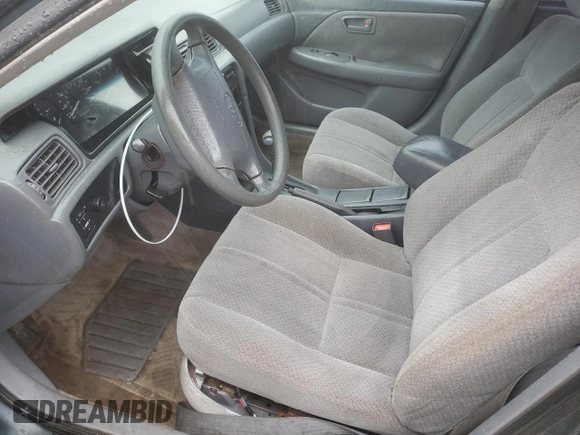 2001 Toyota Camry CE z VIN JT2BG22K710561238, wystawiony jako Copart lot #56686255 z przebiegiem Nie podano mil oraz Szkoda całkowita • Salvage title. Historia ofert i sprzedaży dostępna na DreamBid. Obrazek 7.