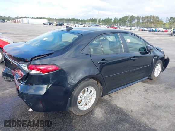 2021 Toyota Corolla Hybrid LE with VIN JTDEAMDE3MJ025426, listed as a IAAI auction lot 41922582 with 57,705 mi miles. Bid and sale history available at carsss.com. Image 4.