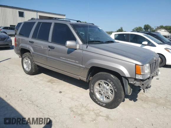 1998 Jeep Grand Cherokee Limited with VIN 1J4GZ78S5WC325148, listed as a Copart auction lot 67780424 with Not provided miles and Salvage title. Bid and sale history available at DreamBid. Image 4.