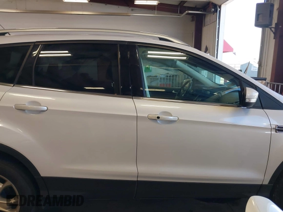 2016 Ford Escape Titanium with VIN 1FMCU9J94GUC28648, listed as a IAAI auction lot 42043761 with 82,509 mi miles and . Bid and sale history available at DreamBid. Image 13.