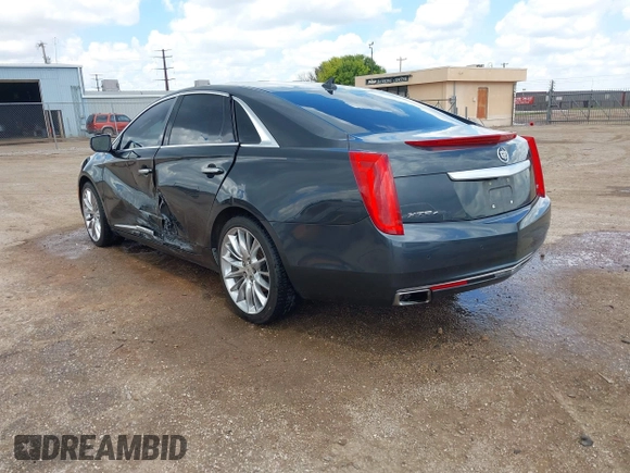 2013 Cadillac XTS Platinum z VIN 2G61V5S32D9102537, wystawiony jako IAAI lot #42230895 z przebiegiem 120 810 mil mil oraz . Historia ofert i sprzedaży dostępna na DreamBid. Obrazek 3.