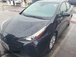 2021 Toyota Prius L Eco z VIN JTDKAMFU1M3151859, wystawiony jako IAAI lot #42516520 z przebiegiem 200 473 mil mil oraz . Historia ofert i sprzedaży dostępna na DreamBid. Obrazek 1.