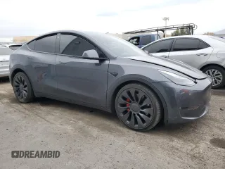 2022 Tesla Model Y Performance with VIN 7SAYGDEF1NF491967, listed as a Copart auction lot 51119515 with 50,520 mi miles and Salvage title. Bid and sale history available at DreamBid. Image 4.