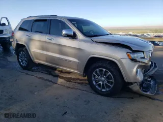 2014 Jeep Grand Cherokee Overland with VIN 1C4RJFCM2EC556953, listed as a Copart auction lot 73046974 with 106,889 mi miles and Salvage Title. Bid and sale history available at carsss.com. Image 4.