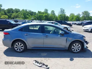 2021 Toyota Corolla LE with VIN JTDEPMAE7MJ144664, listed as a IAAI auction lot 42269698 with 23,500 mi miles and . Bid and sale history available at DreamBid. Image 14.