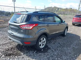 2016 Ford Escape SE with VIN 1FMCU9GX5GUA06660, listed as a IAAI auction lot 42043031 with 87,719 mi miles. Bid and sale history available at carsss.com. Image 4.