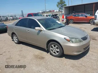 2002 Toyota Camry LE z VIN 4T1BE32K22U545537, wystawiony jako IAAI lot #41969747 z przebiegiem 194 746 mil mil oraz . Historia ofert i sprzedaży dostępna na DreamBid. Obrazek 1.