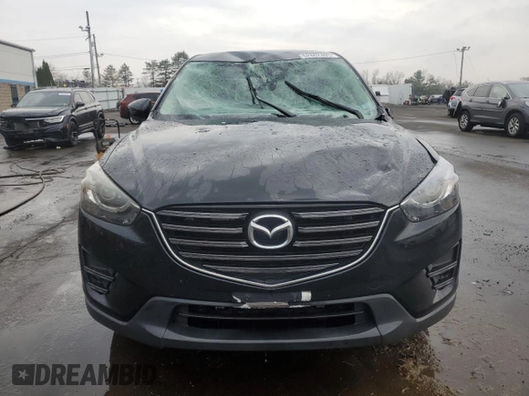 2016 Mazda CX-5 Grand Touring with VIN JM3KE4DYXG0711367, listed as a Copart auction lot 52862405 with 87,870 mi miles and Salvage Title. Bid and sale history available at DreamBid. Image 5.