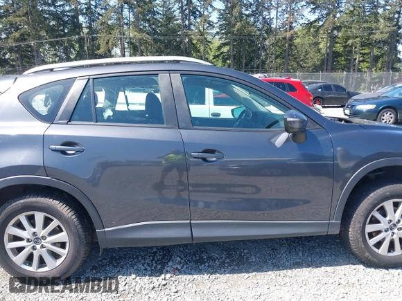 2015 Mazda CX-5 Sport z VIN JM3KE4BY5F0540612, wystawiony jako IAAI lot #42109082 z przebiegiem 83 874 mil mil oraz . Historia ofert i sprzedaży dostępna na DreamBid. Obrazek 14.