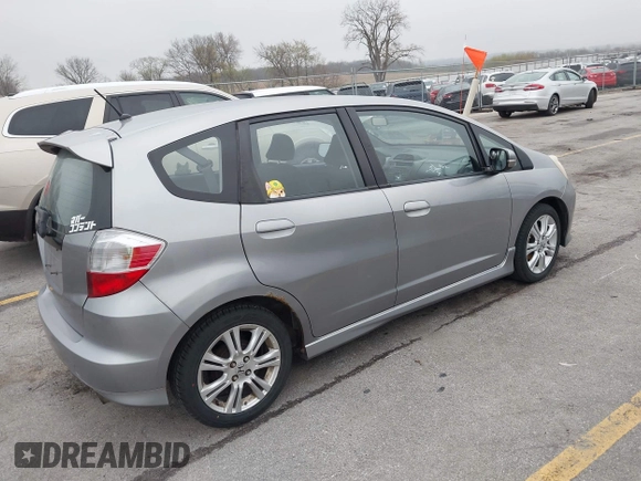 2009 Honda Fit Sport with VIN JHMGE88469S063030, listed as a IAAI auction lot 42064670 with 156,791 mi miles. Bid and sale history available at carsss.com. Image 4.