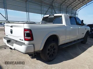 2021 Ram 2500 Laramie with VIN 3C6UR5NLXMG677847, listed as a IAAI auction lot 40992410 with 106,912 mi miles. Bid and sale history available at carsss.com. Image 4.