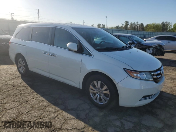 2014 Honda Odyssey EX-L with VIN 5FNRL5H61EB005740, listed as a Copart auction lot 54663595 with 118,971 mi miles and Salvage Title. Bid and sale history available at DreamBid. Image 4.