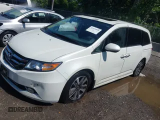 2014 Honda Odyssey Touring with VIN 5FNRL5H94EB071788, listed as a IAAI auction lot 42523959 with 244,734 mi miles and . Bid and sale history available at DreamBid. Image 17.