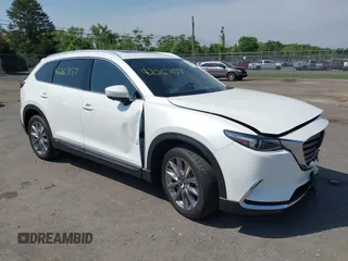 2021 Mazda CX-9 Grand Touring z VIN JM3TCBDY8M0537986, wystawiony jako IAAI lot #42267157 z przebiegiem 25 375 mil mil oraz . Historia ofert i sprzedaży dostępna na DreamBid. Obrazek 1.