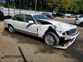 1996 Jaguar XJ with VIN SAJHX1747TC767829, listed as a Copart auction lot 76677444 with Not provided miles and Salvage title. Bid and sale history available at DreamBid. Image 4.