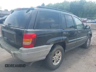 2003 Jeep Grand Cherokee Laredo with VIN 1J4GW48S03C557756, listed as a IAAI auction lot 42507884 with 195,236 mi miles and . Bid and sale history available at DreamBid. Image 4.