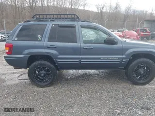 2003 Jeep Grand Cherokee Limited with VIN 1J4GW58N43C521617, listed as a IAAI auction lot 41781064 with 228,086 mi miles. Bid and sale history available at carsss.com. Image 13.