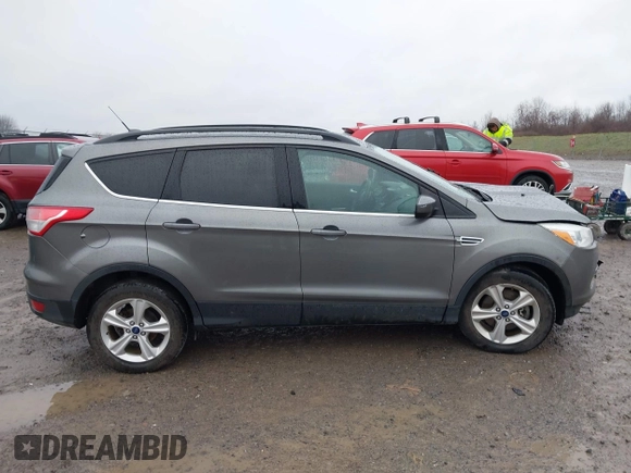 2014 Ford Escape SE with VIN 1FMCU9GX3EUB91417, listed as a IAAI auction lot 42009257 with 87,164 mi miles and . Bid and sale history available at DreamBid. Image 13.