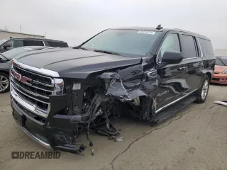 2023 GMC Yukon XL SLT with VIN 1GKS2GKD5PR363433, listed as a Copart auction lot 85979734 with 61,957 mi miles and Salvage Title. Bid and sale history available at carsss.com. Image 1.