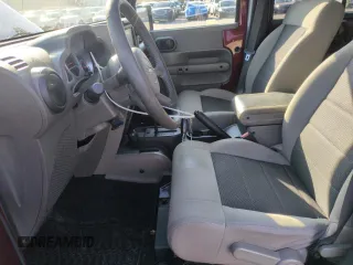 2010 Jeep Wrangler Unlimited Rubicon with VIN 1J4BA6H13AL140902, listed as a Copart auction lot 54335455 with 118,423 mi miles and Clean title. Bid and sale history available at DreamBid. Image 7.