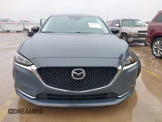 2021 Mazda 6 Carbon Edition with VIN JM1GL1WY0M1600414, listed as a IAAI auction lot 41551393 with 36,780 mi miles and . Bid and sale history available at DreamBid. Image 12.