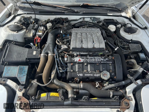 1992 Mitsubishi 3000GT z VIN JA3XE74CXNY058167, wystawiony jako Copart lot #84192254 z przebiegiem 69 411 mil mil oraz Czysty tytuł • Clean title. Historia ofert i sprzedaży dostępna na DreamBid. Obrazek 7.