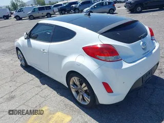 2015 Hyundai Veloster z VIN KMHTC6AD5FU231224, wystawiony jako IAAI lot #41944186 z przebiegiem 103 124 mil mil oraz . Historia ofert i sprzedaży dostępna na DreamBid. Obrazek 3.