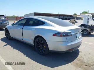 2013 Tesla Model S with VIN 5YJSA1CN5DFP11381, listed as a IAAI auction lot 42087803 with 146,818 mi miles and . Bid and sale history available at DreamBid. Image 3.