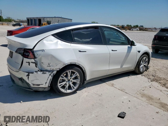 2023 Tesla Model Y Long Range z VIN 7SAYGDEE1PA155629, wystawiony jako Copart lot #52234735 z przebiegiem 24 944 mil mil oraz Szkoda całkowita • Salvage title. Historia ofert i sprzedaży dostępna na DreamBid. Obrazek 3.