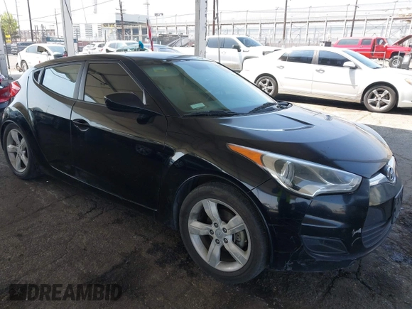 2013 Hyundai Veloster w/Black Int with VIN KMHTC6AD6DU088815, listed as a IAAI auction lot 42184776 with 204,930 mi miles and . Bid and sale history available at DreamBid. Image 1.
