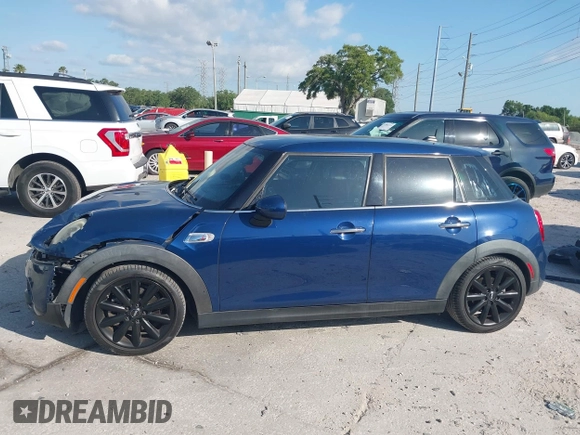2016 MINI Cooper Hardtop 4 Door S with VIN WMWXU3C54G2D30766, listed as a IAAI auction lot 42008026 with 101,898 mi miles. Bid and sale history available at carsss.com. Image 14.