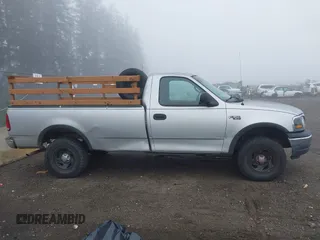 1999 Ford F-150 with VIN 2FTZF1828XCA85643, listed as a IAAI auction lot 41347113 with 173,813 mi miles and . Bid and sale history available at DreamBid. Image 13.