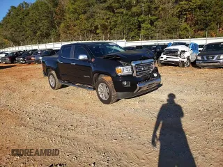 2018 GMC Canyon 4WD SLT with VIN 1GTG6DEN4J1296628, listed as a Copart auction lot 77135484 with 74,486 mi miles and Salvage Title. Bid and sale history available at carsss.com. Image 11.