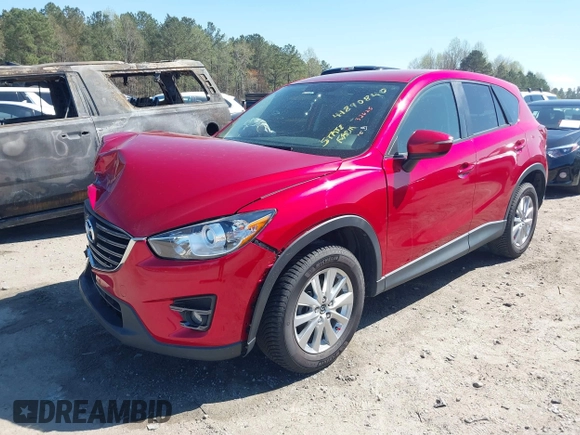 2016 Mazda CX-5 Touring with VIN JM3KE4CY0G0890309, listed as a IAAI auction lot 41890840 with 89,023 mi miles and . Bid and sale history available at carsss.com. Image 2.