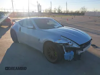 2014 Nissan 370Z Nismo with VIN JN1AZ4EH4EM634236, listed as a IAAI auction lot 41256664 with 80,294 mi miles and . Bid and sale history available at DreamBid. Image 1.