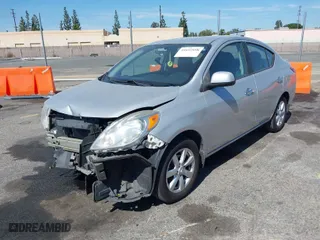 2014 Nissan Versa SV with VIN 3N1CN7AP1EL846198, listed as a IAAI auction lot 41692898 with 104,874 mi miles. Bid and sale history available at carsss.com. Image 2.