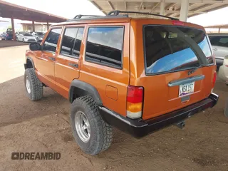 1997 Jeep Cherokee Sport with VIN 1J4FJ68SXVL517077, listed as a IAAI auction lot 42350553 with Not provided miles and . Bid and sale history available at DreamBid. Image 3.