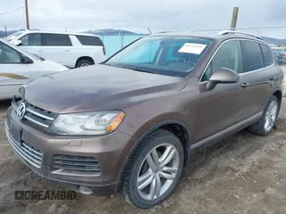 2013 Volkswagen Touareg Lux with VIN WVGEF9BP1DD012851, listed as a IAAI auction lot 41732391 with 123,283 mi miles and . Bid and sale history available at DreamBid. Image 2.