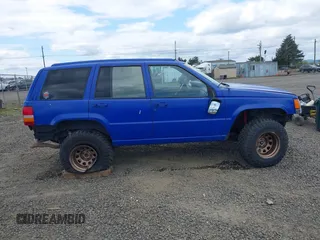 1996 Jeep Grand Cherokee Laredo with VIN 1J4GZ58YXTC329037, listed as a IAAI auction lot 42051175 with 314,571 mi miles and . Bid and sale history available at DreamBid. Image 13.
