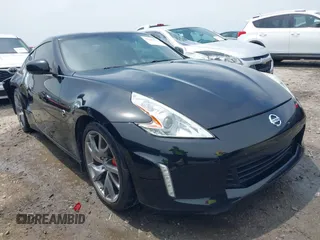 2014 Nissan 370Z Nismo z VIN JN1AZ4EH5EM637162, wystawiony jako IAAI lot #42281774 z przebiegiem 180 566 mil mil oraz . Historia ofert i sprzedaży dostępna na DreamBid. Obrazek 1.