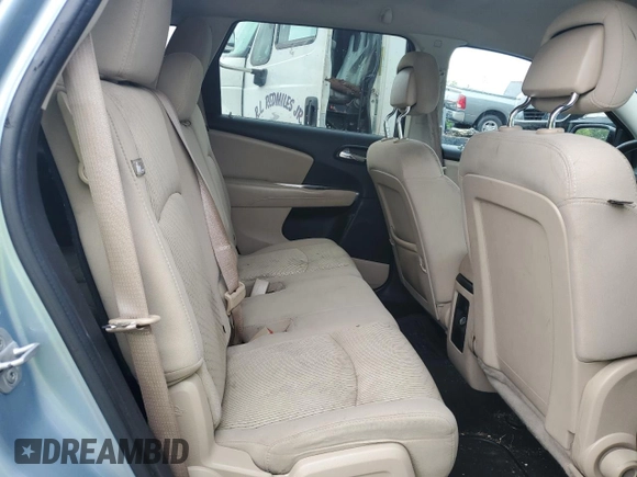 2013 Dodge Journey SXT with VIN 3C4PDCBG0DT619382, listed as a Copart auction lot 56565205 with 176,112 mi miles and Salvage title. Bid and sale history available at DreamBid. Image 11.