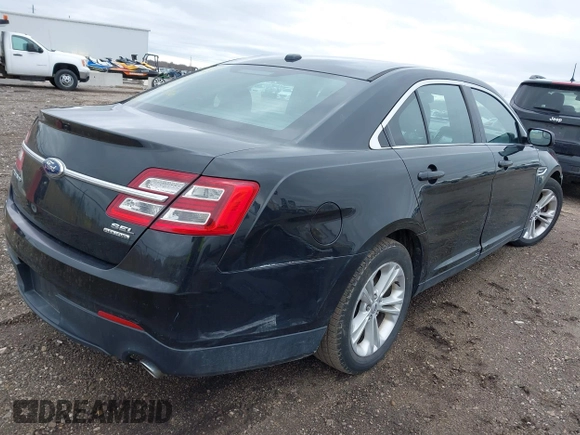 2014 Ford Taurus SEL with VIN 1FAHP2E80EG114996, listed as a IAAI auction lot 41908983 with 136,864 mi miles. Bid and sale history available at carsss.com. Image 4.
