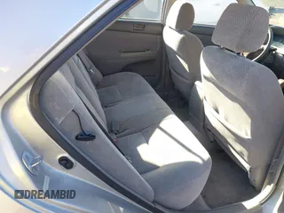 2002 Toyota Camry XLE z VIN 4T1BF30K82U506516, wystawiony jako IAAI lot #41278261 z przebiegiem 211 049 mil mil oraz . Historia ofert i sprzedaży dostępna na DreamBid. Obrazek 8.