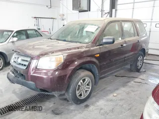 2007 Honda Pilot LX with VIN 2HKYF18137H519304, listed as a IAAI auction lot 42203155 with 128,712 mi miles and . Bid and sale history available at carsss.com. Image 2.