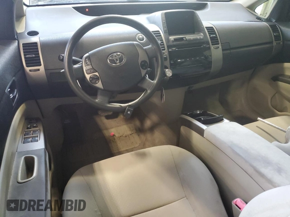 2007 Toyota Prius z VIN JTDKB20U577556730, wystawiony jako Copart lot #61117255 z przebiegiem Nie podano mil oraz Nie do naprawy • Non repairable. Historia ofert i sprzedaży dostępna na DreamBid. Obrazek 8.