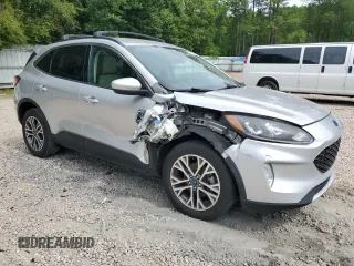 2020 Ford Escape SEL z VIN 1FMCU9H66LUB44403, wystawiony jako Copart lot #57934925 z przebiegiem Nie podano mil oraz Szkoda całkowita • Salvage title. Historia ofert i sprzedaży dostępna na DreamBid. Obrazek 4.