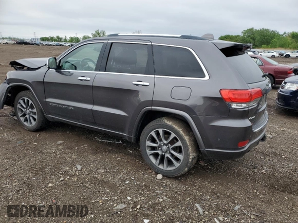 2017 Jeep Grand Cherokee Overland with VIN 1C4RJFCG8HC607872, listed as a Copart auction lot 57493195 with 164,478 mi miles and Salvage title. Bid and sale history available at DreamBid. Image 2.